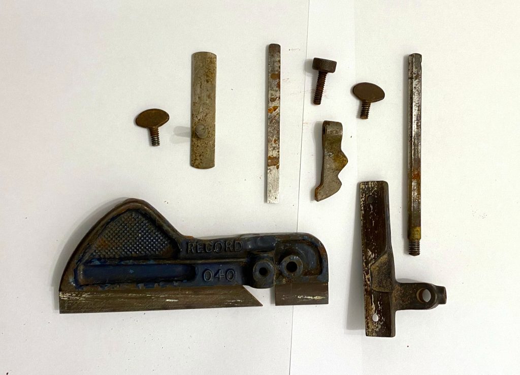 Disassembled Record 040 plough plane before rust has been removed