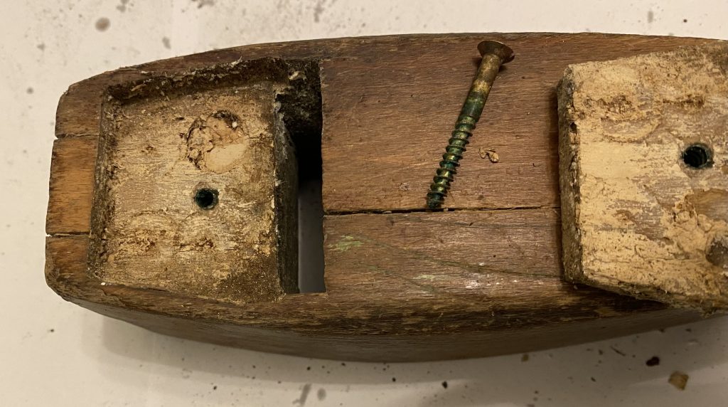 Showing wooden plane with mouth insert taken out