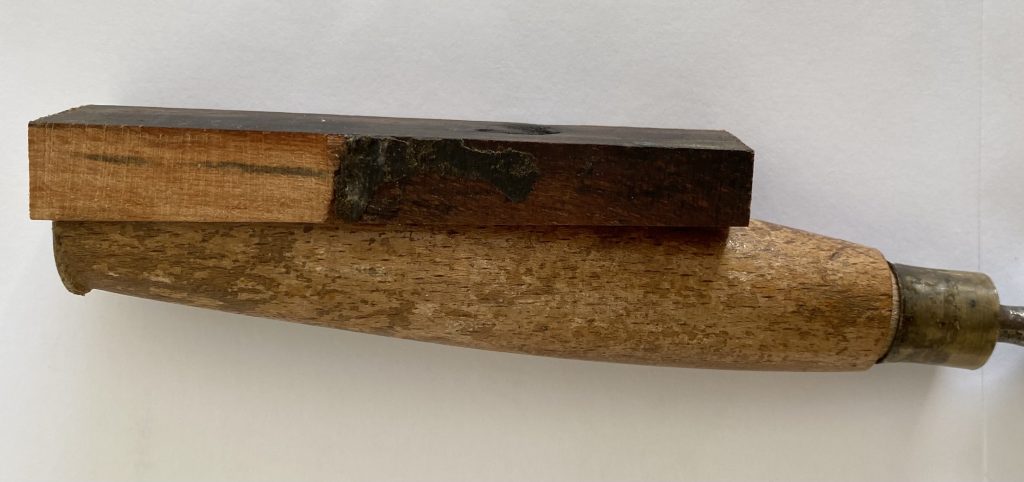 New piece of wood glued to split handle chisel
